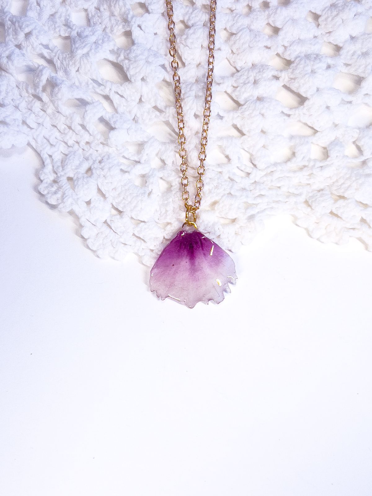 Necklace pendant made from a real dianthus flower petal.