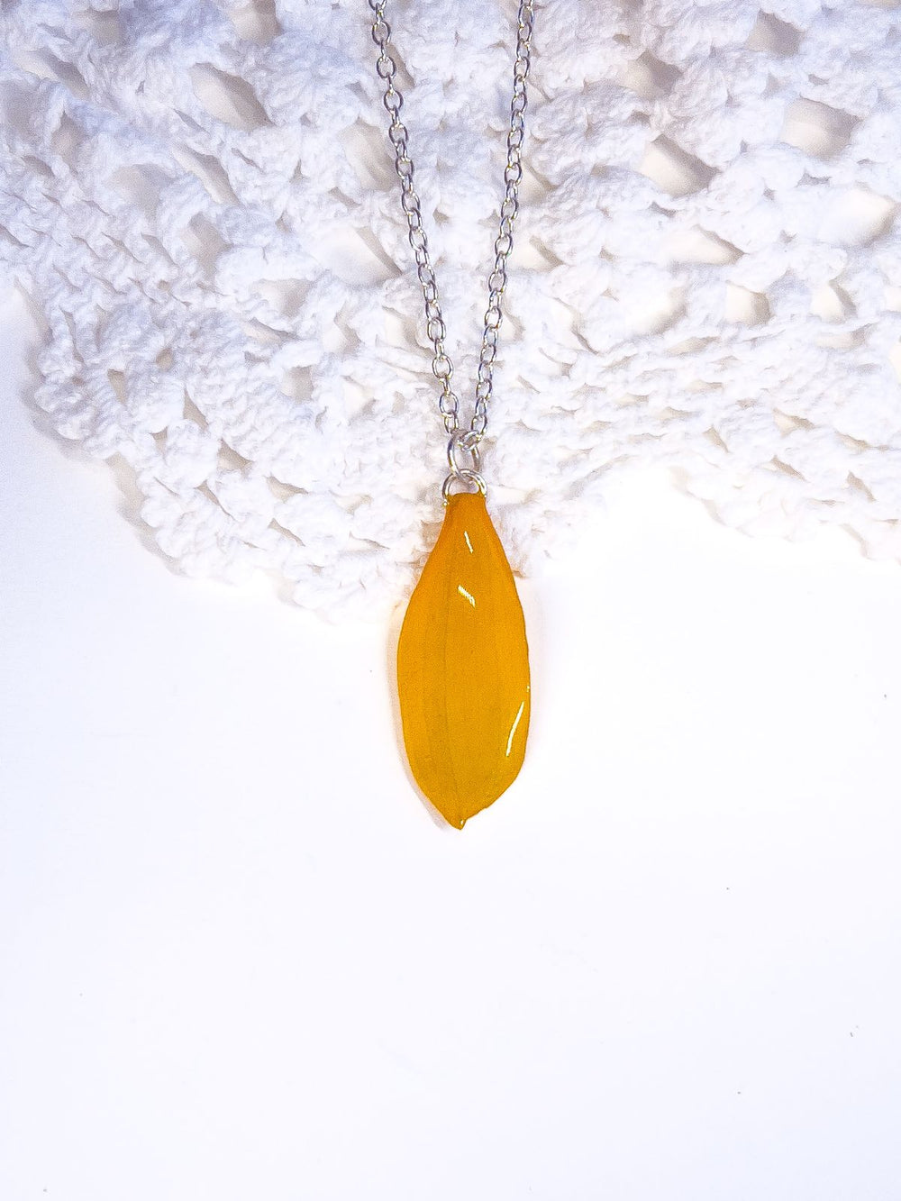 Brown eyed Susan petal made into a necklace pendant.