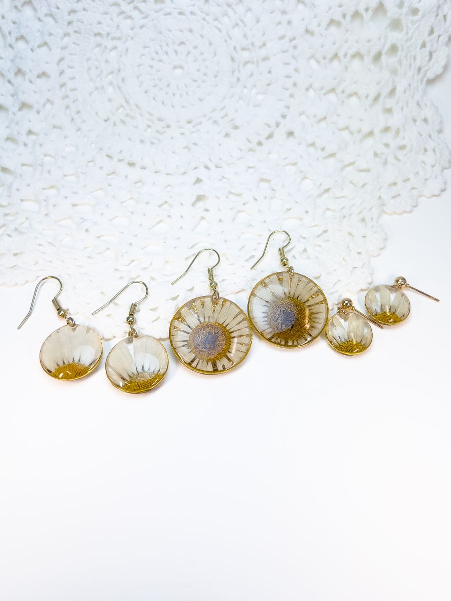 Small, medium, and large pair of real daisy earrings.