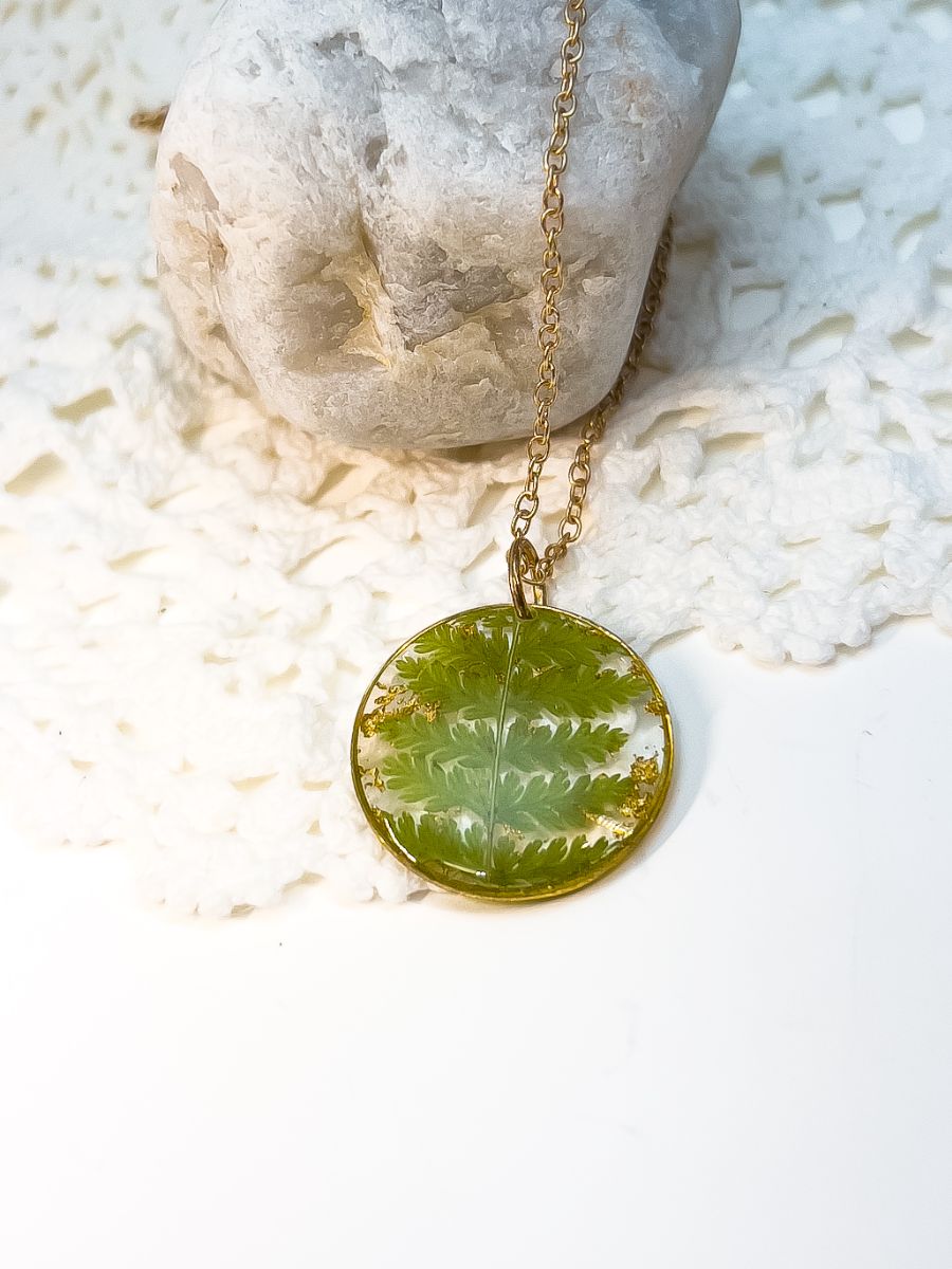 Round pendant necklace made with pressed ferns from Nova Scotia.