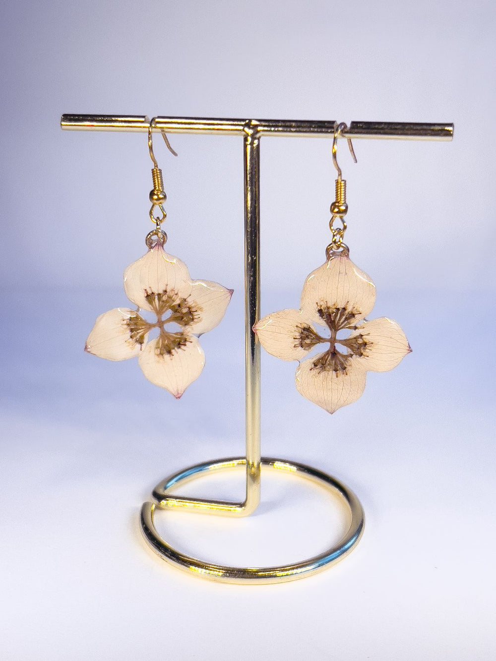 Pressed dogwood flowers made into dangle earrings. 