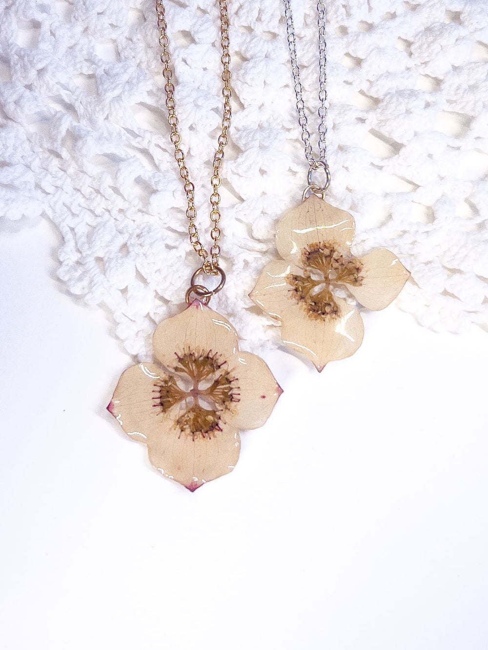 Pair of necklaces made with pressed dogwood flowers from Nova Scotia. 