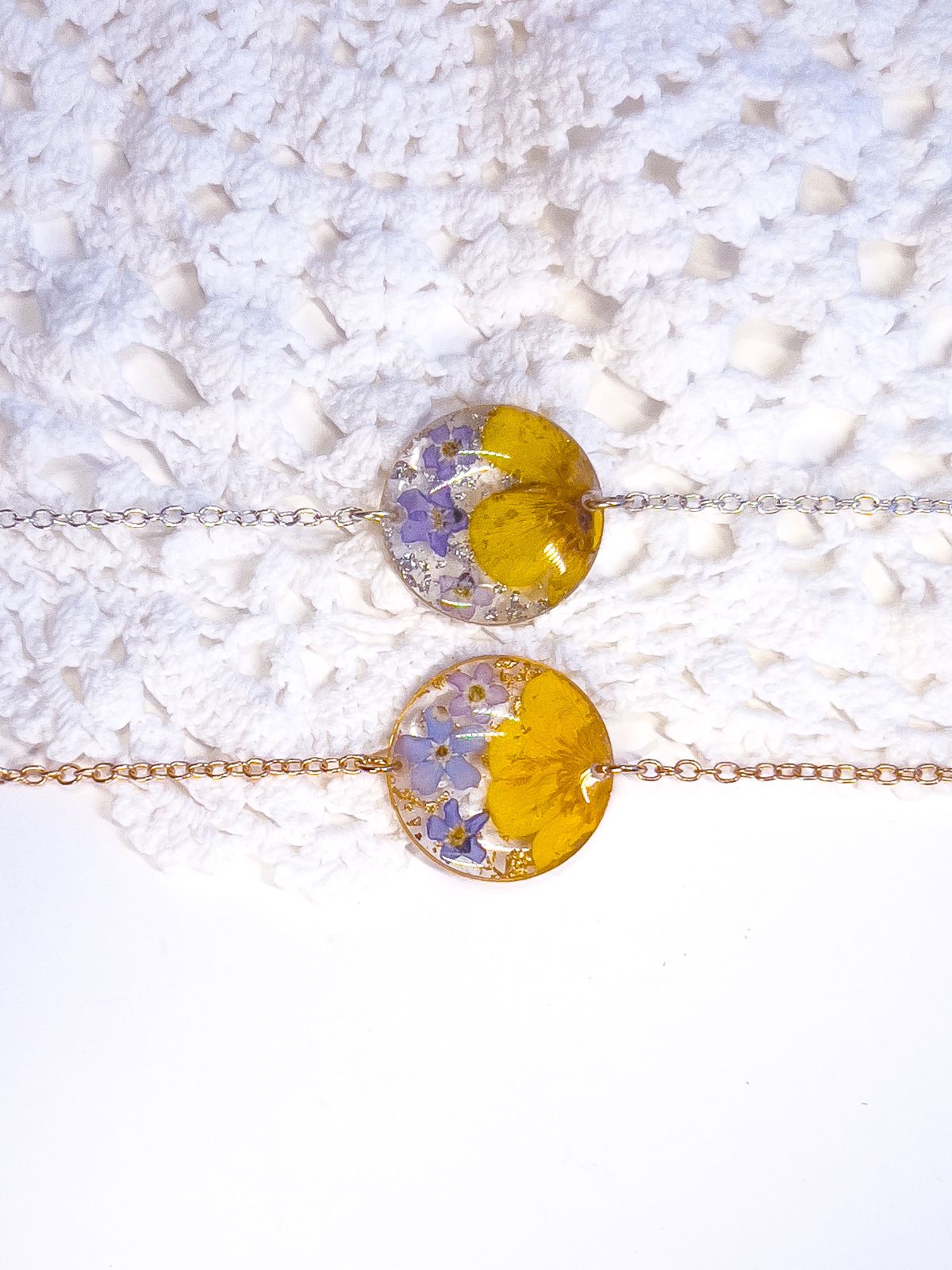 Forget-me-not and buttercup real flower bracelets in gold and silver.