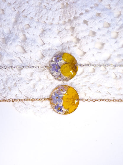 Forget-me-not and buttercup real flower bracelets in gold and silver.