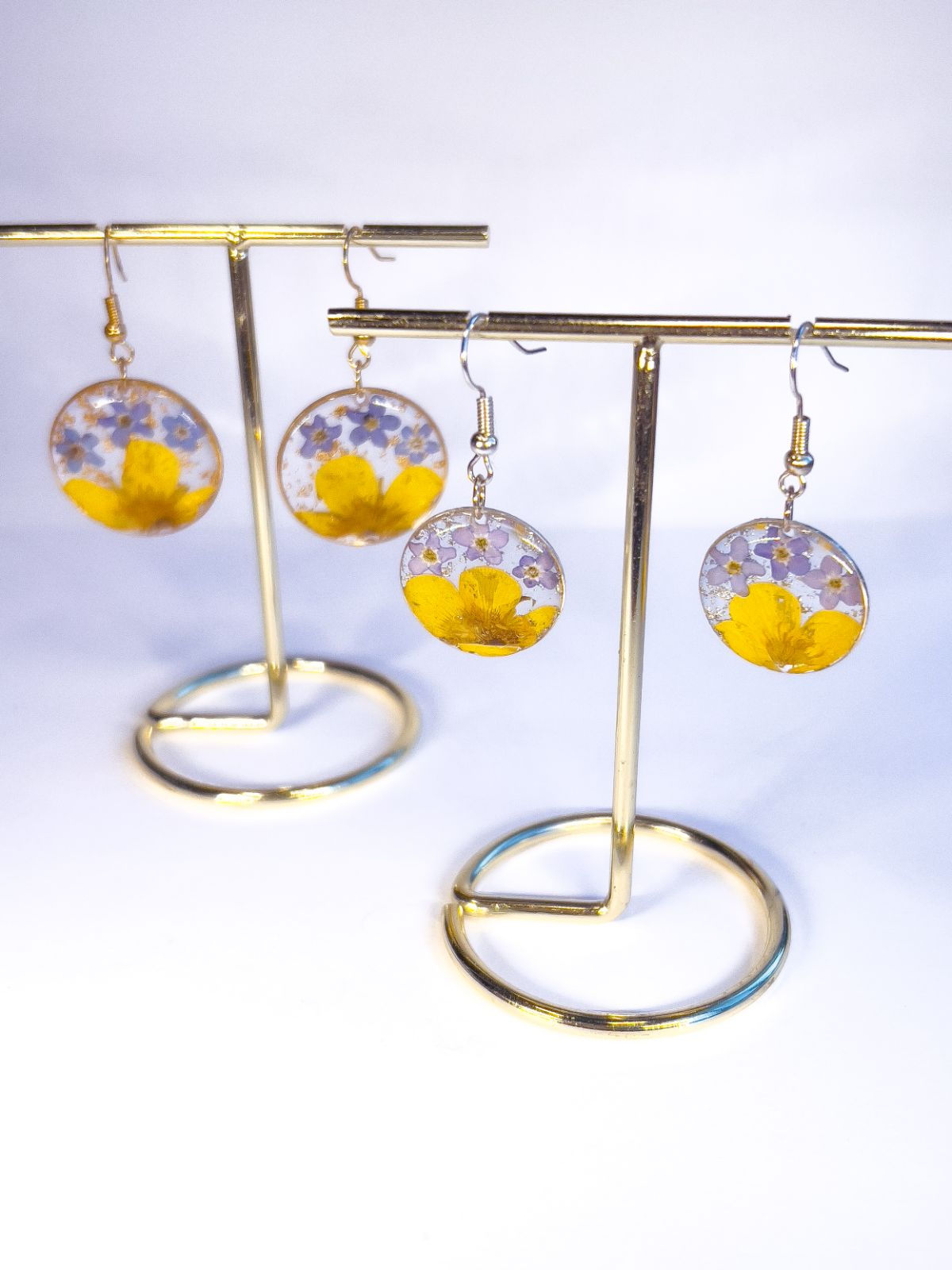 Dangle earrings made from real forget-me-nots and buttercup flowers. 