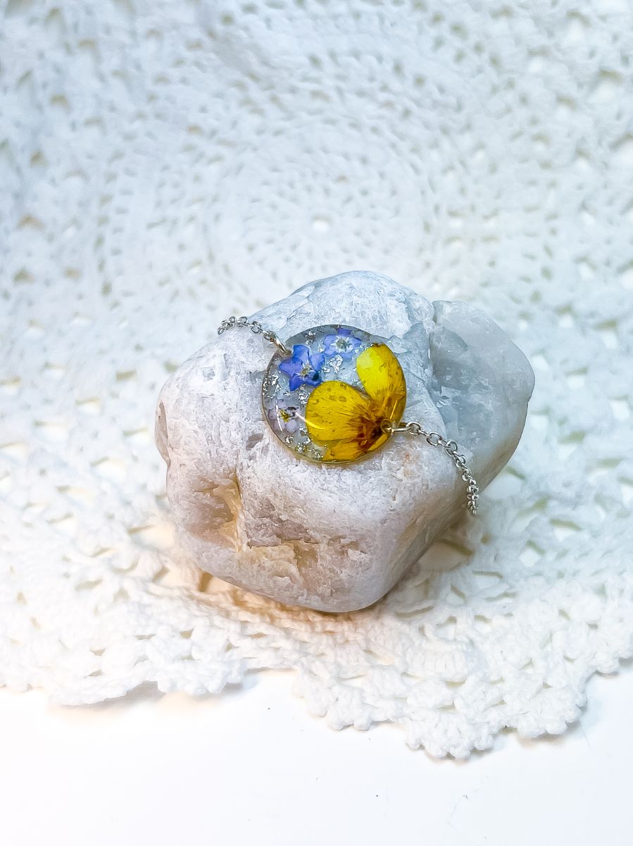 Silver bracelet made with real buttercups and forget-me-nots.