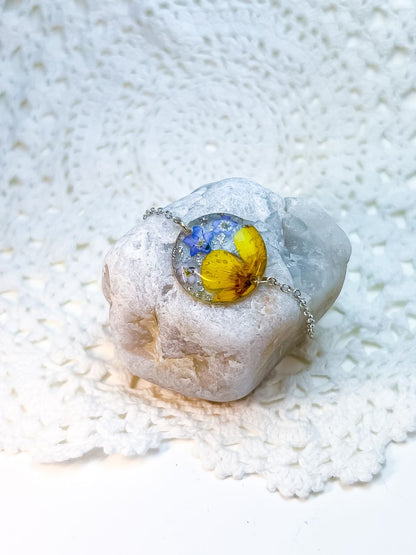 Silver bracelet made with real buttercups and forget-me-nots.